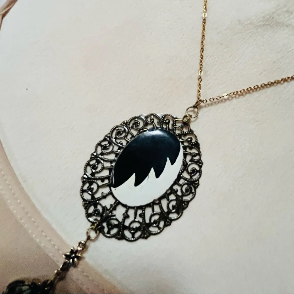 Handcrafted Cruella de Vil cameo bat accent pendant on chain necklace